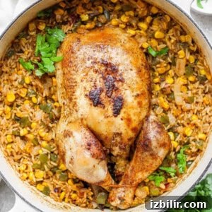 chicken with rice and corn in a skillet.
