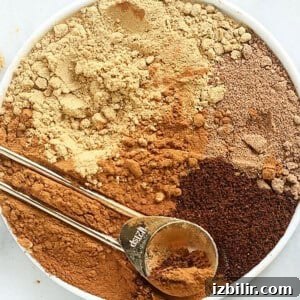 a bowl full of ingredients for a pumpkin spice latte, including pumpkin pie spice.