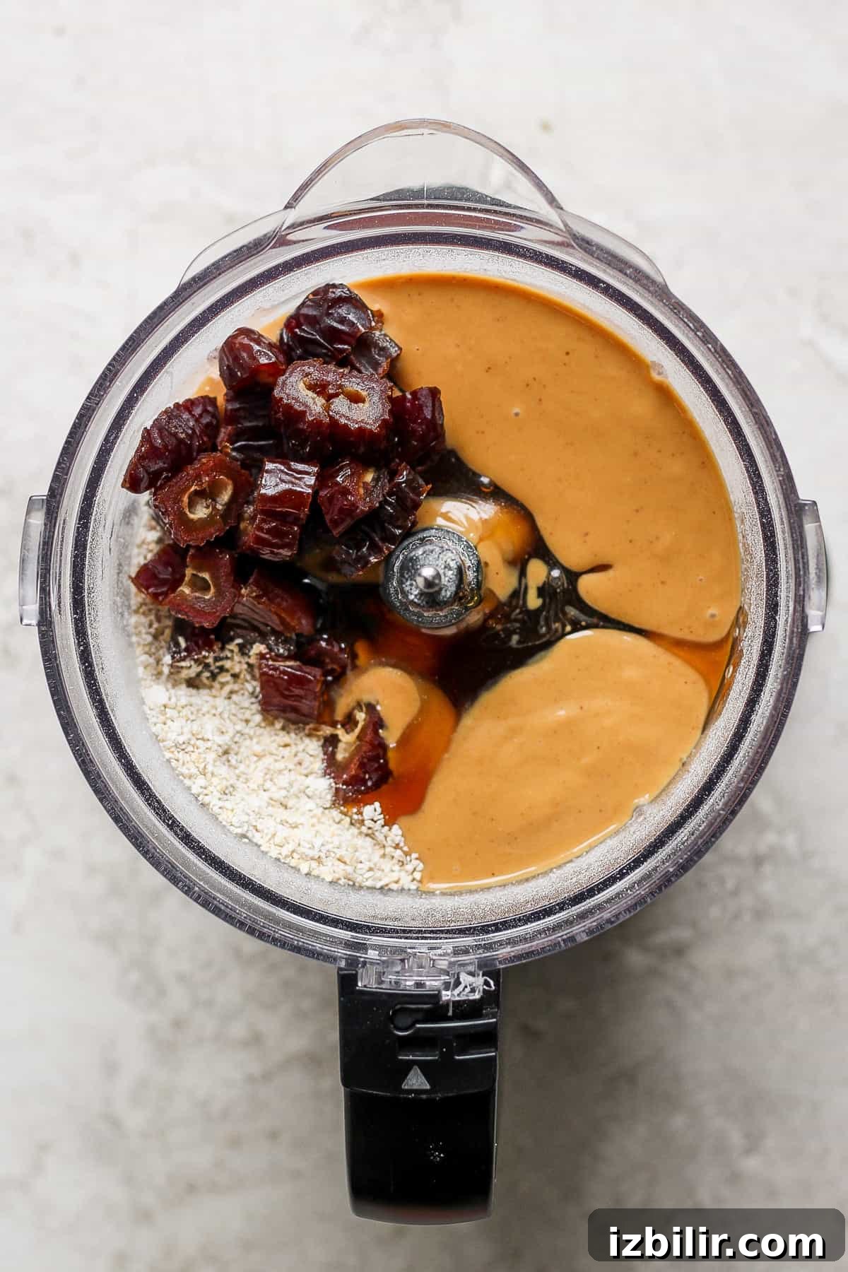 September 2023 Fit Foodie Cooking Club: Seasonal Recipes 3 a food processor filled with ingredients for a peanut butter granola.