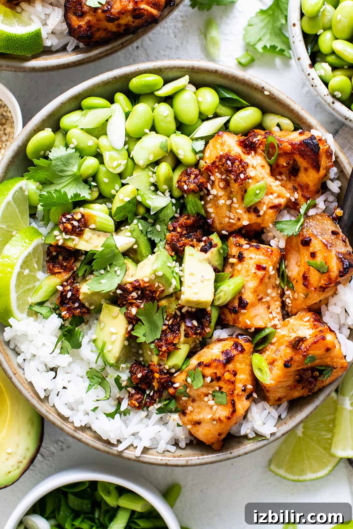 Crispy Air Fryer Honey-Chili Crunch Salmon Bites 6 Rice bowl with salmon bites.