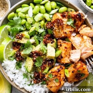 Crispy Air Fryer Honey-Chili Crunch Salmon Bites 7 Finished salmon rice bowl with toppings.