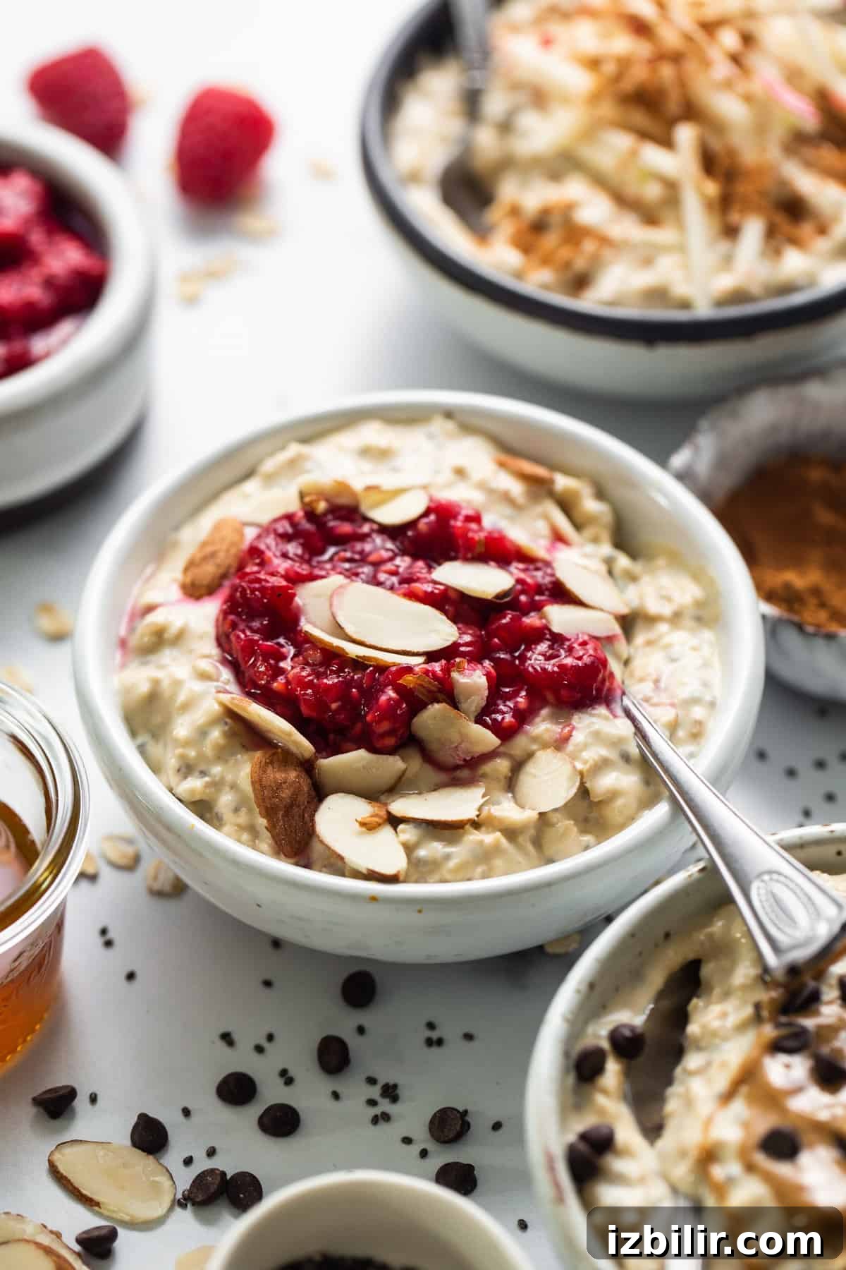 3 Protein-Packed Overnight Oats Recipes 9 a bowl of oatmeal with raspberries and almonds.
