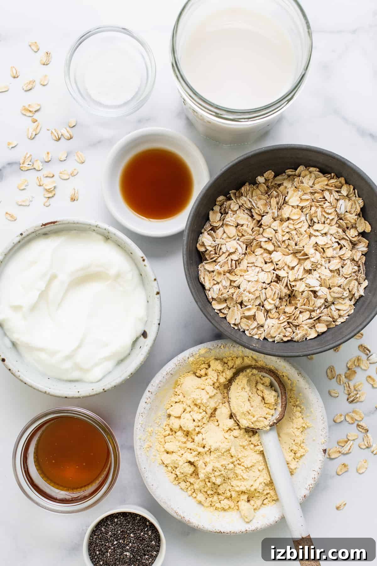 3 Protein-Packed Overnight Oats Recipes 3 a table topped with bowls of food and a spoon.