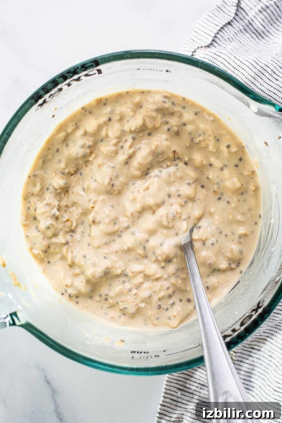 3 Protein-Packed Overnight Oats Recipes 5 a bowl of food with a spoon in it.
