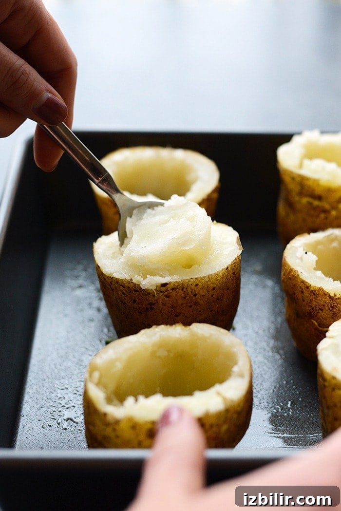 twice baked potatoes with innards being scooped out