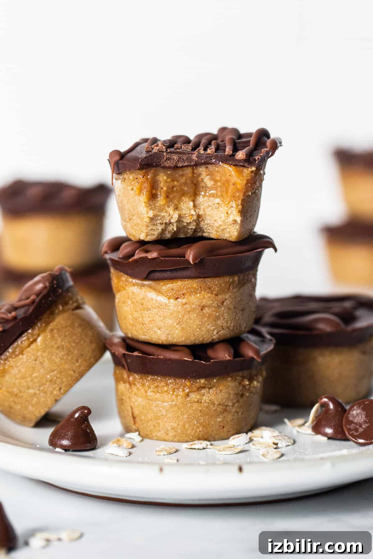 No-Bake Peanut Butter Twix Cups Recipe 2 Peanut butter cups stacked on a plate.