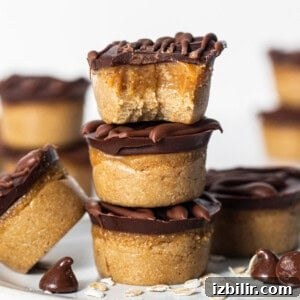 Peanut butter cups stacked on a plate.