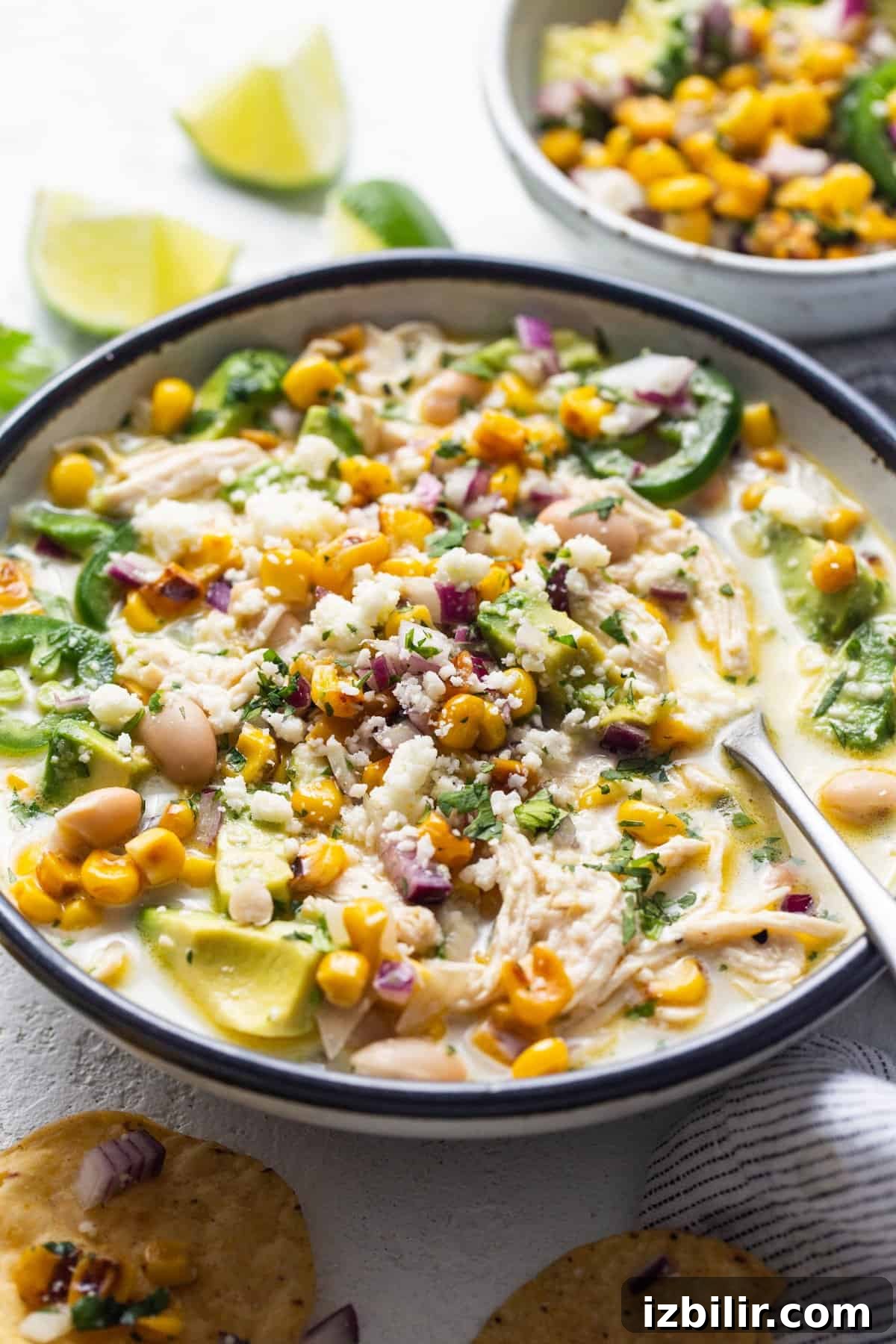 Fit Foodie Cooking Club October 2023: Recipes and Menus 6 A bowl of chicken and corn soup with tortilla chips.