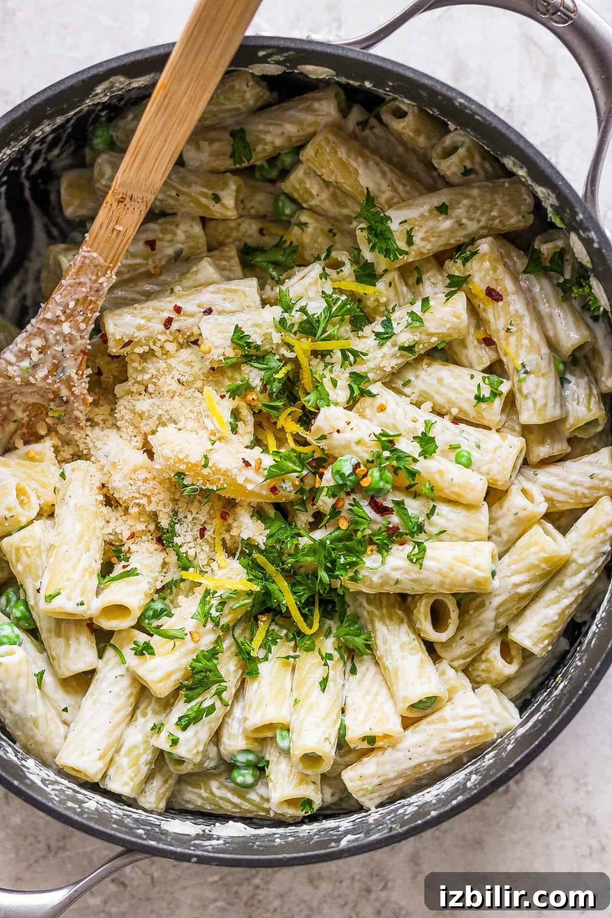 Creamy One-Pot Boursin Pasta Recipe 2 Penne pasta in a pan with parmesan cheese and parsley.