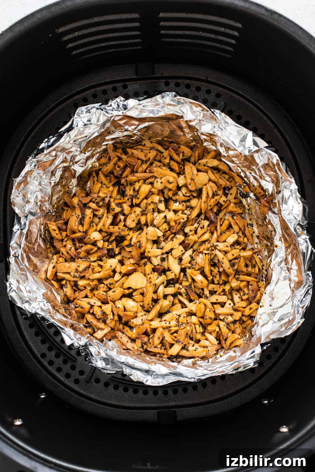Crispy Air Fryer Brussels Sprouts Salad 6 An air fryer filled with nuts.