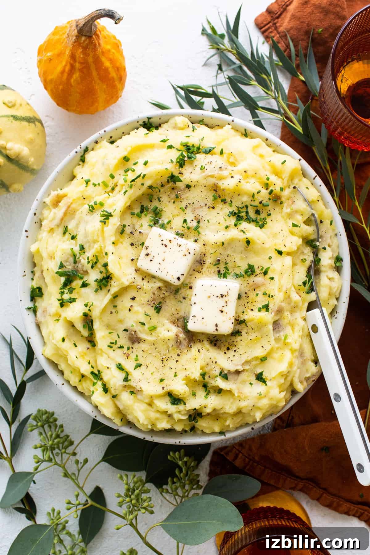 A bowl of mashed potatoes with feta cheese.
