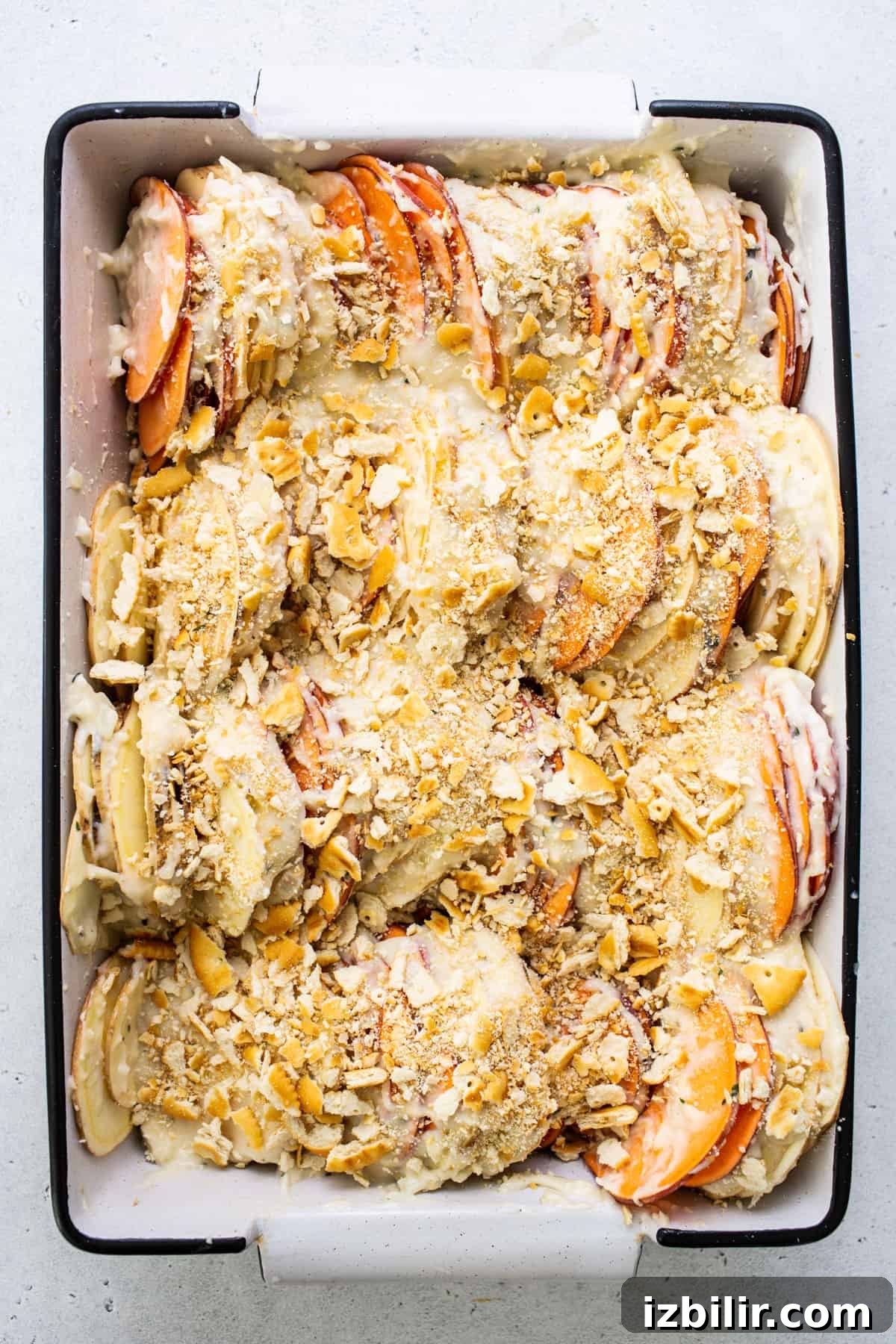 Classic Sweet Potato Au Gratin Recipe 8 A baking dish filled with fruit and nuts.