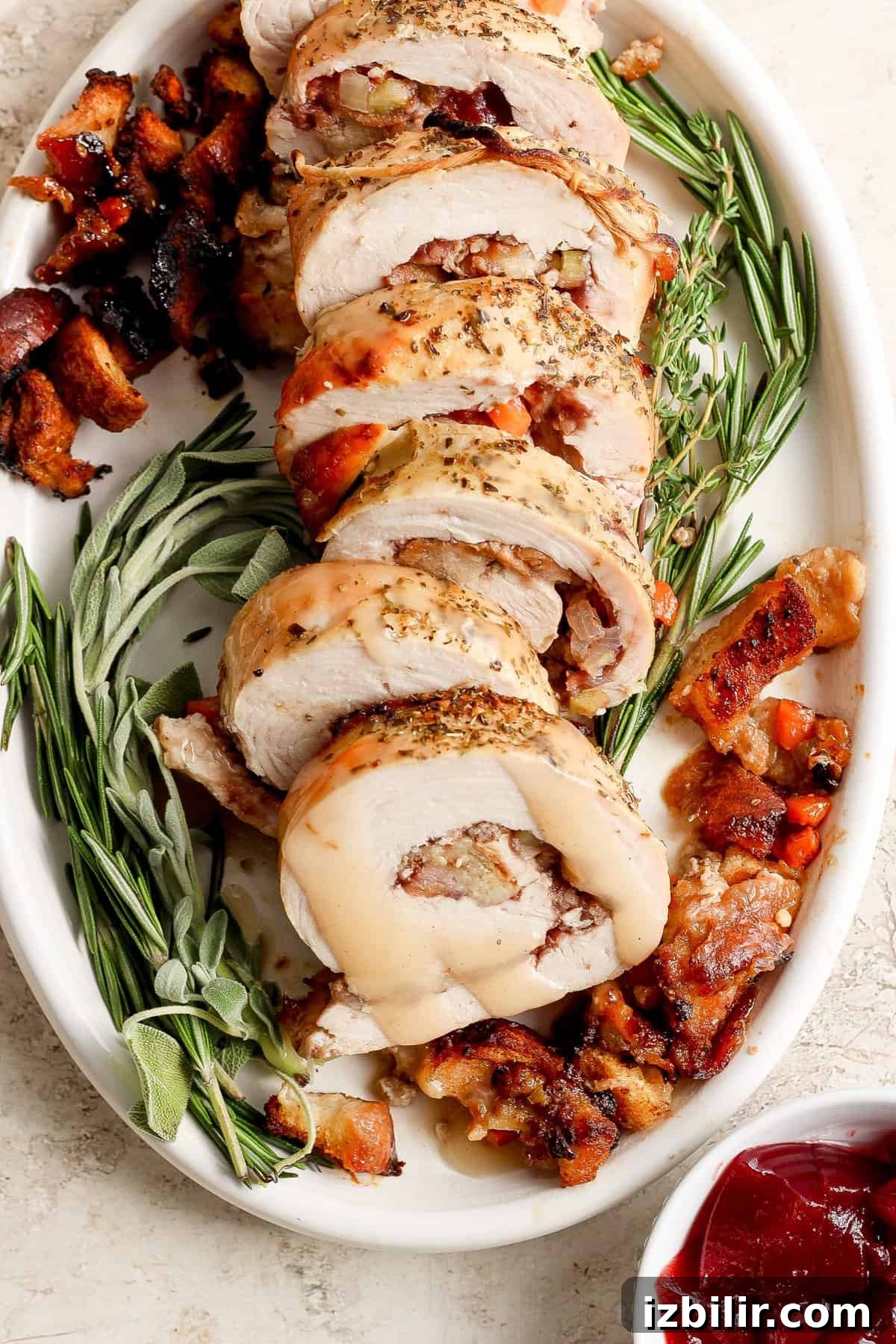 Thanksgiving Turkey Roulade Recipe with Italian Sausage Stuffing 2 Roasted turkey stuffed with cranberries and sage.
