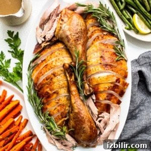 Thanksgiving Turkey Roulade Recipe with Italian Sausage Stuffing 4 Turkey sliced and on a platter.