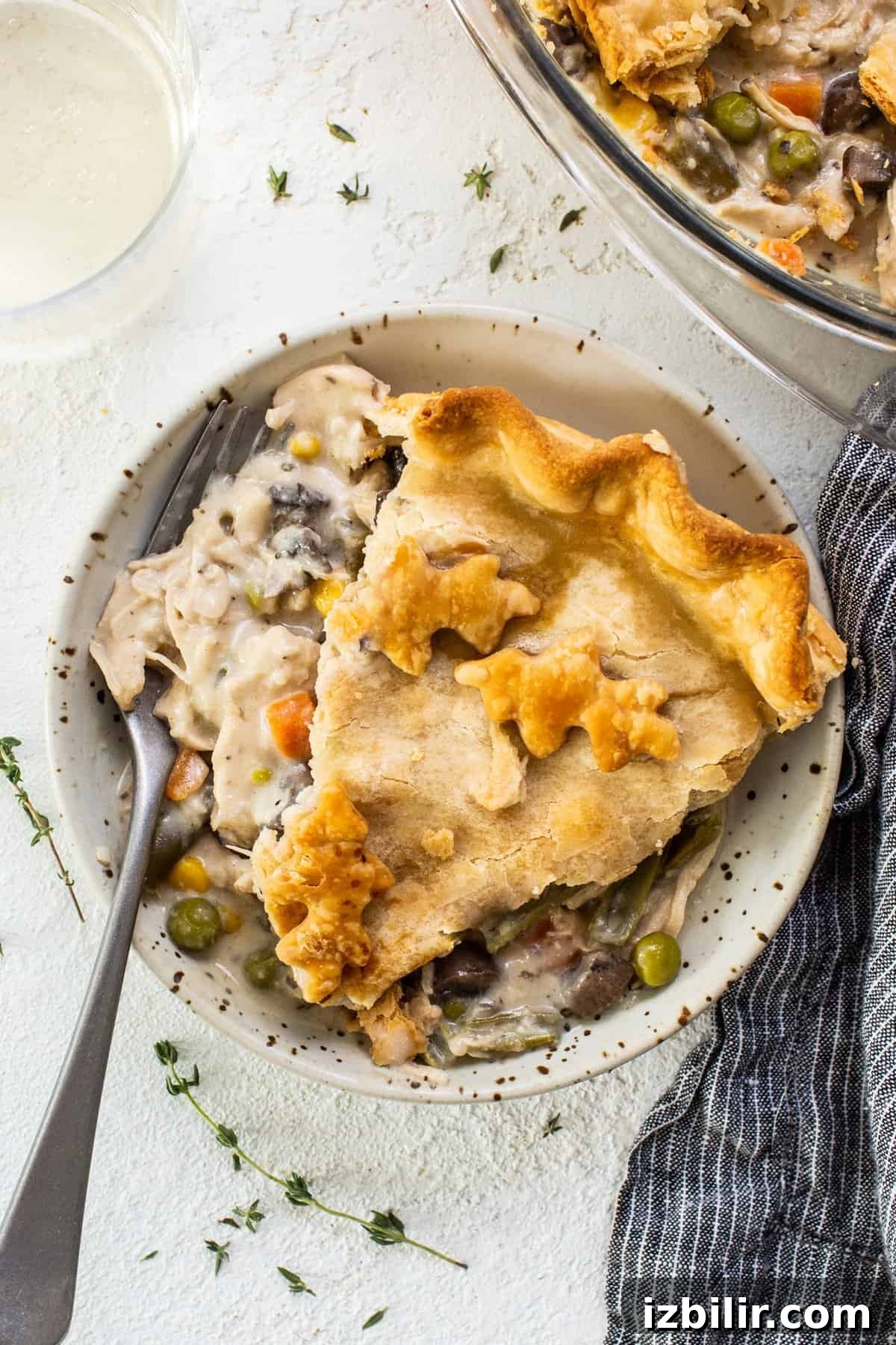A slice of chicken pot pie on a plate.