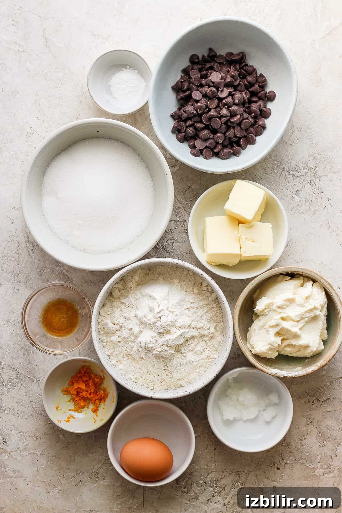 Zesty Chocolate Orange Ricotta Cookies 3 Ingredients for the chocolate orange ricotta cookies in bowls on a table.