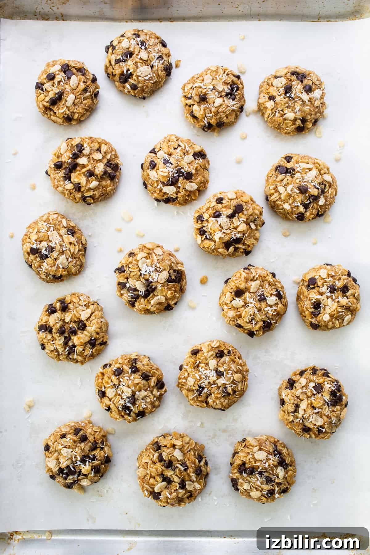 Chewy Flourless Ranger Cookies with Chocolate and Oats 5 Chocolate chip cookies on a baking sheet.