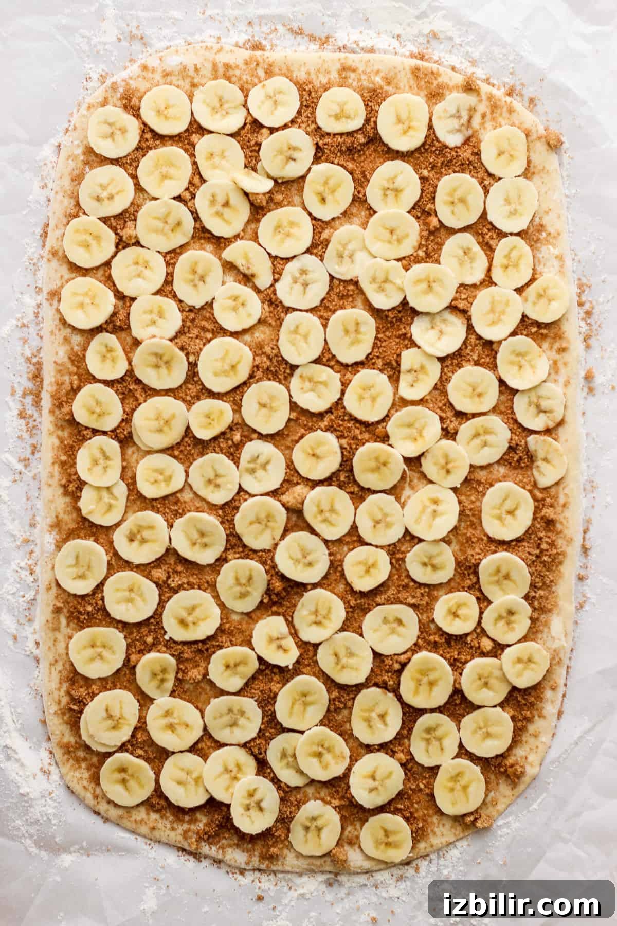 Brown Butter Banana Bread Cinnamon Rolls Recipe 4 Banana slices on paper.