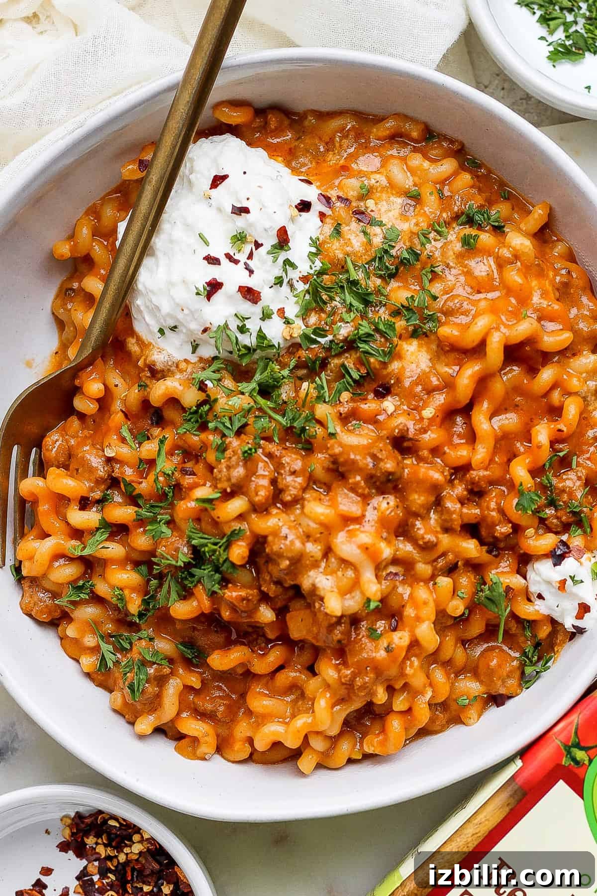 One-Pot Lasagna Pasta Recipe: Creamy Skillet Lasagna 2 A bowl of pasta with meat sauce and sour cream.