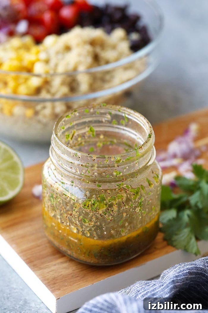 Zesty Mexican Quinoa Salad with Avocado and Black Beans 4 dressing in mason jar