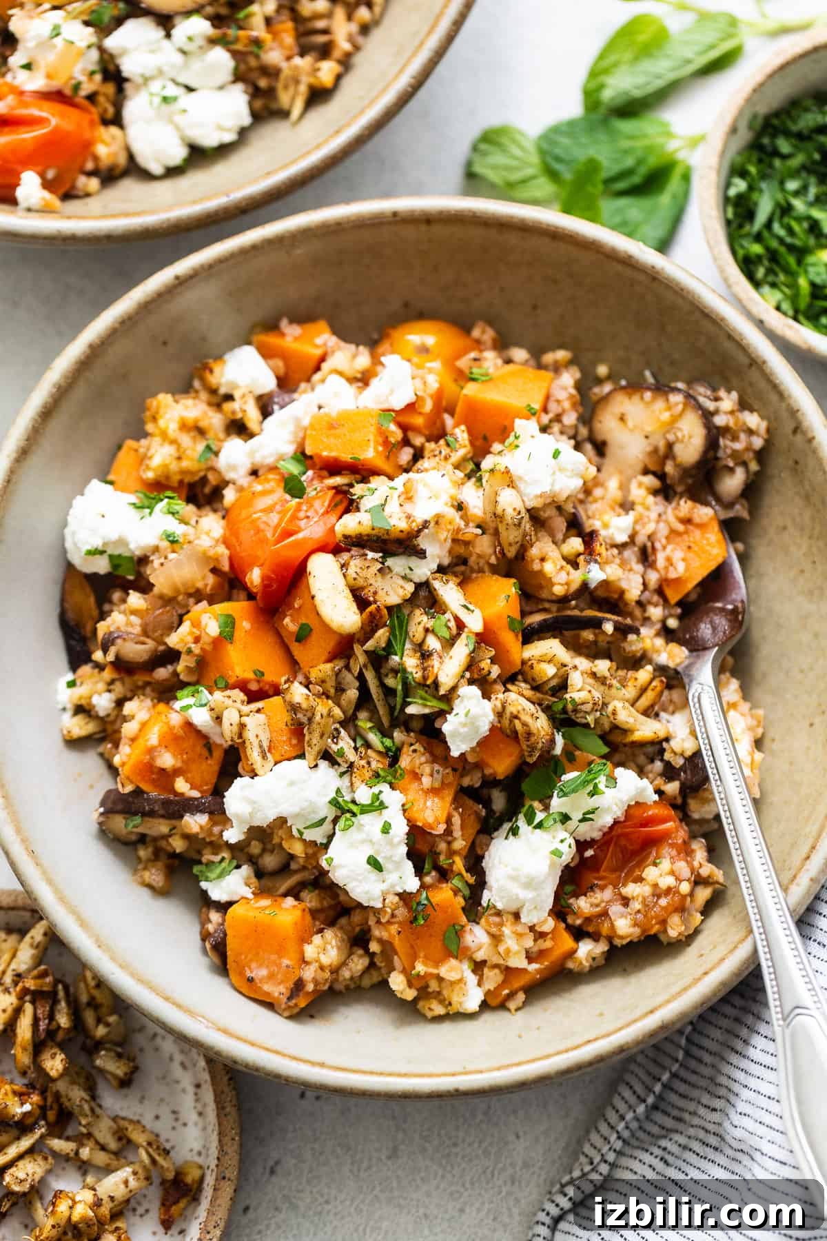 Roasted Sweet Potato and Mushroom Grain Bowl Recipe 2 A bowl of roasted squash and feta risotto.