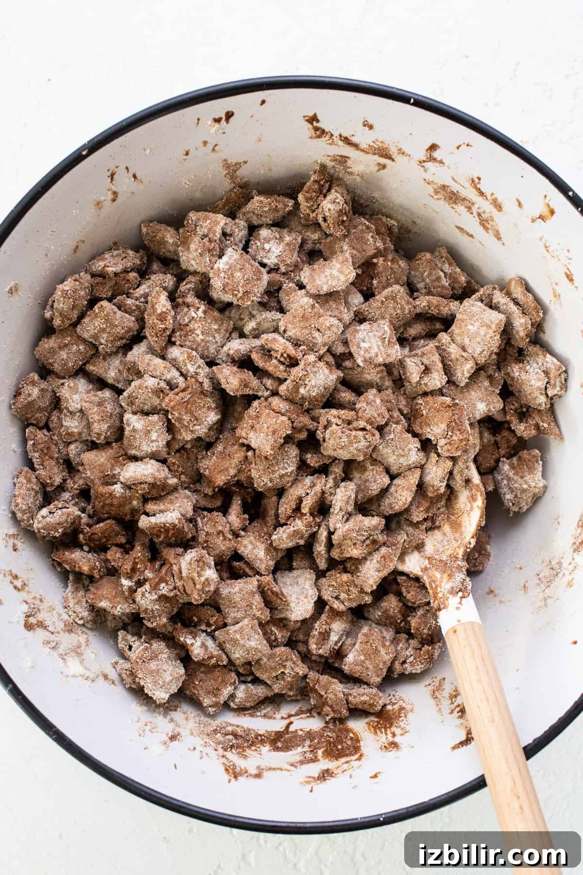 A bowl filled with a mixture of granola and chocolate chips.
