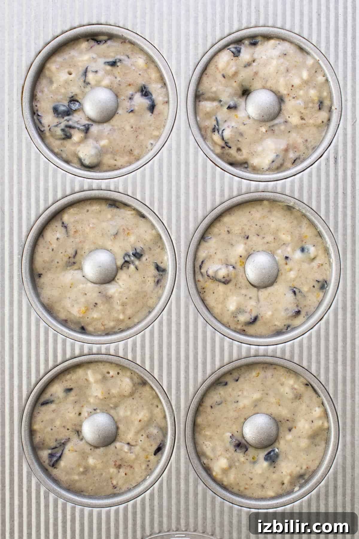 A muffin tin filled with muffins.