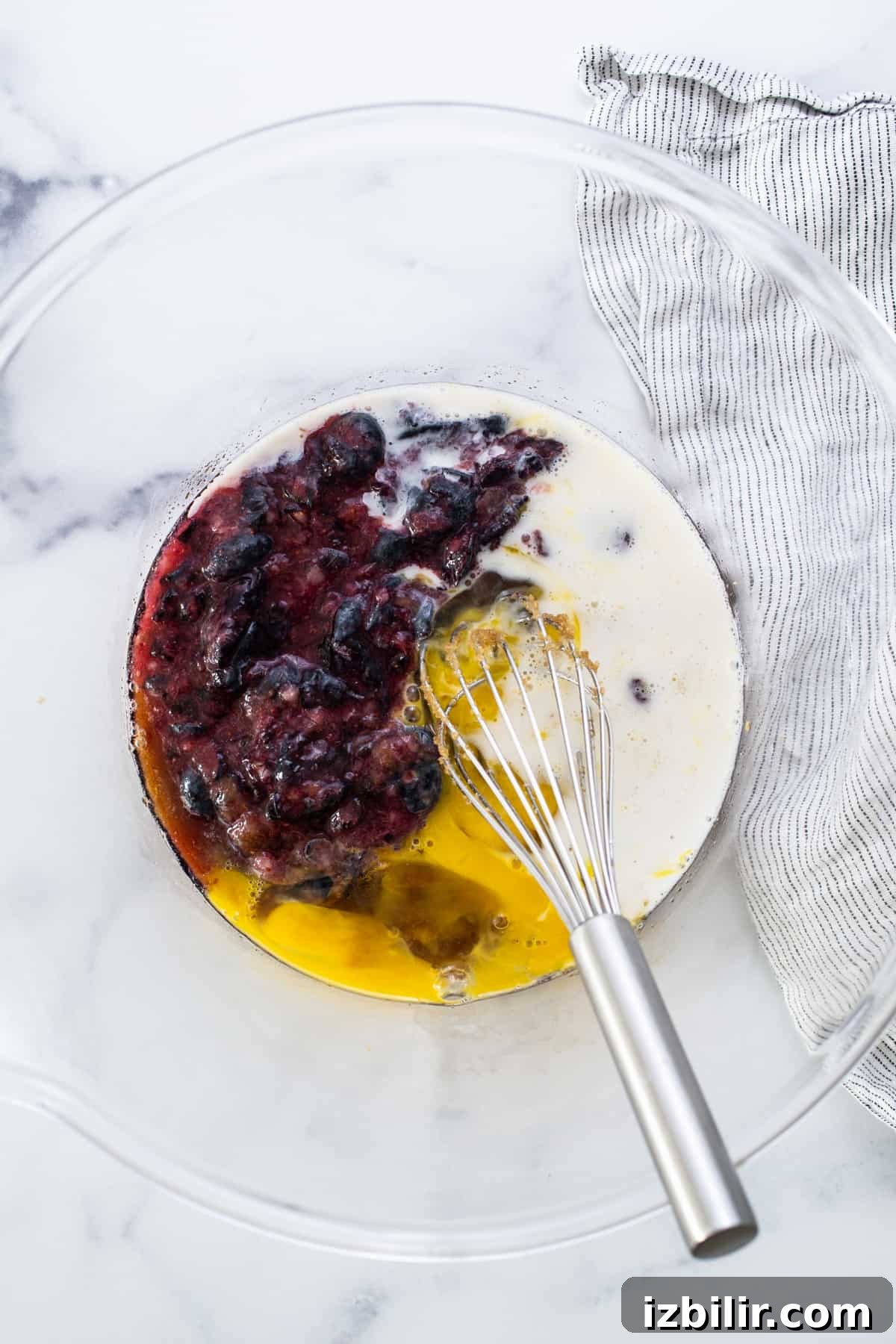 A bowl with berries and eggs in it.