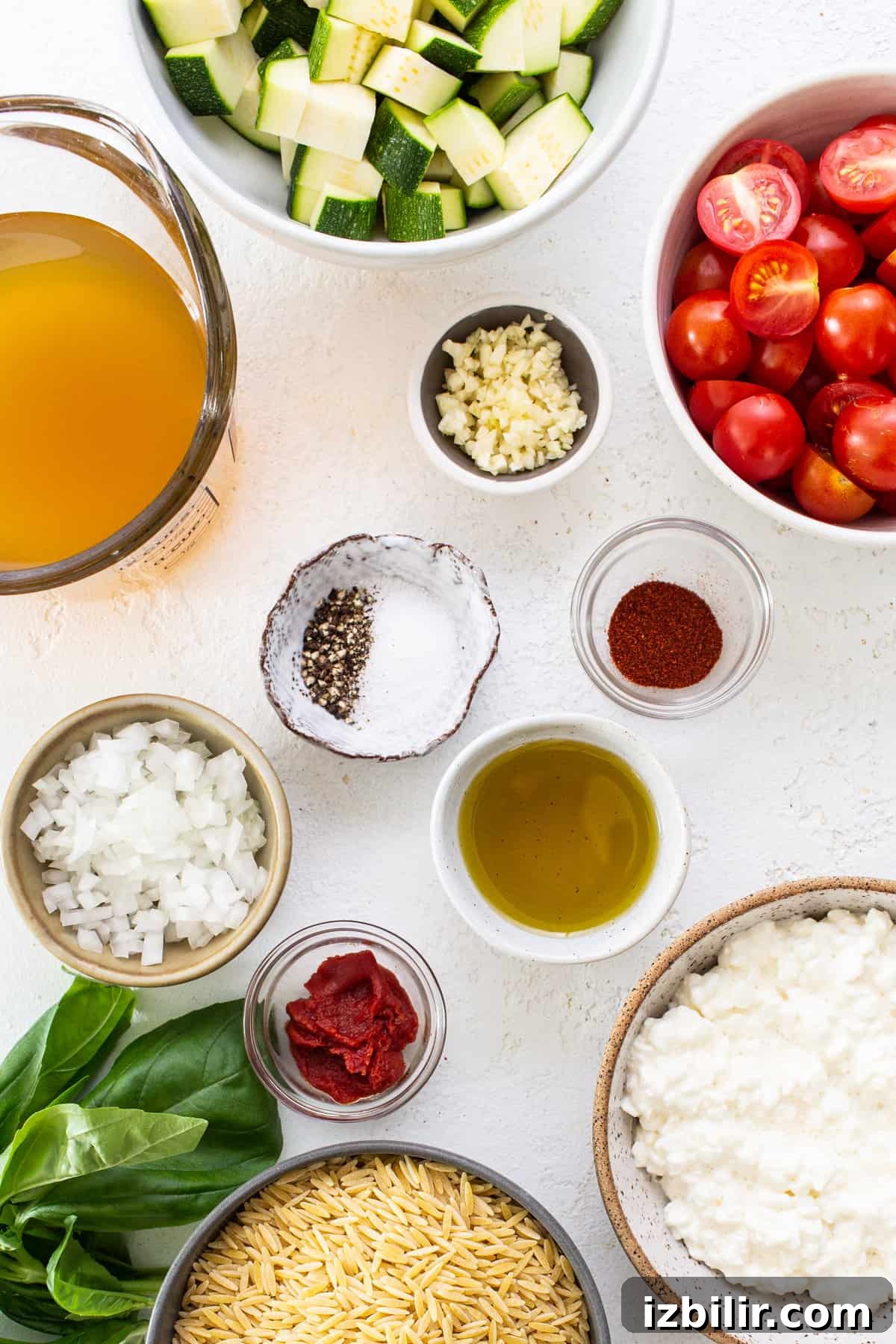 One-Pot Creamy Tomato Orzo with Fresh Basil 3 Ingredients for a pasta dish including tomatoes, zucchini, and basil.