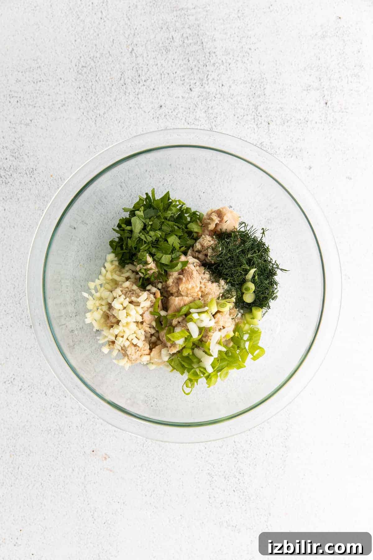 Salmon Stuffed Avocados Recipe with Dill and Lemon 6 All the ingredients for the salmon salad in a bowl.