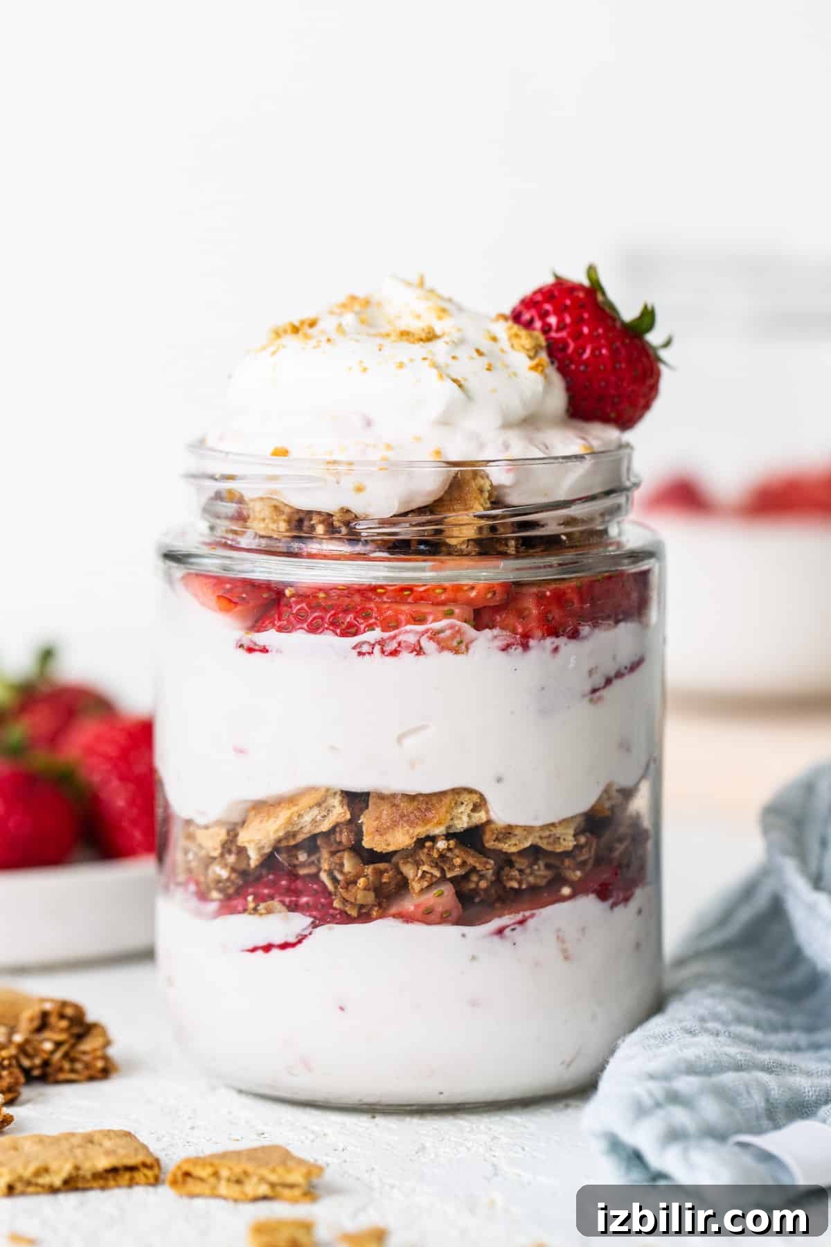 Strawberry Protein Cheesecake Jars with Cottage Cheese 2 Strawberry granola parfait in a jar.
