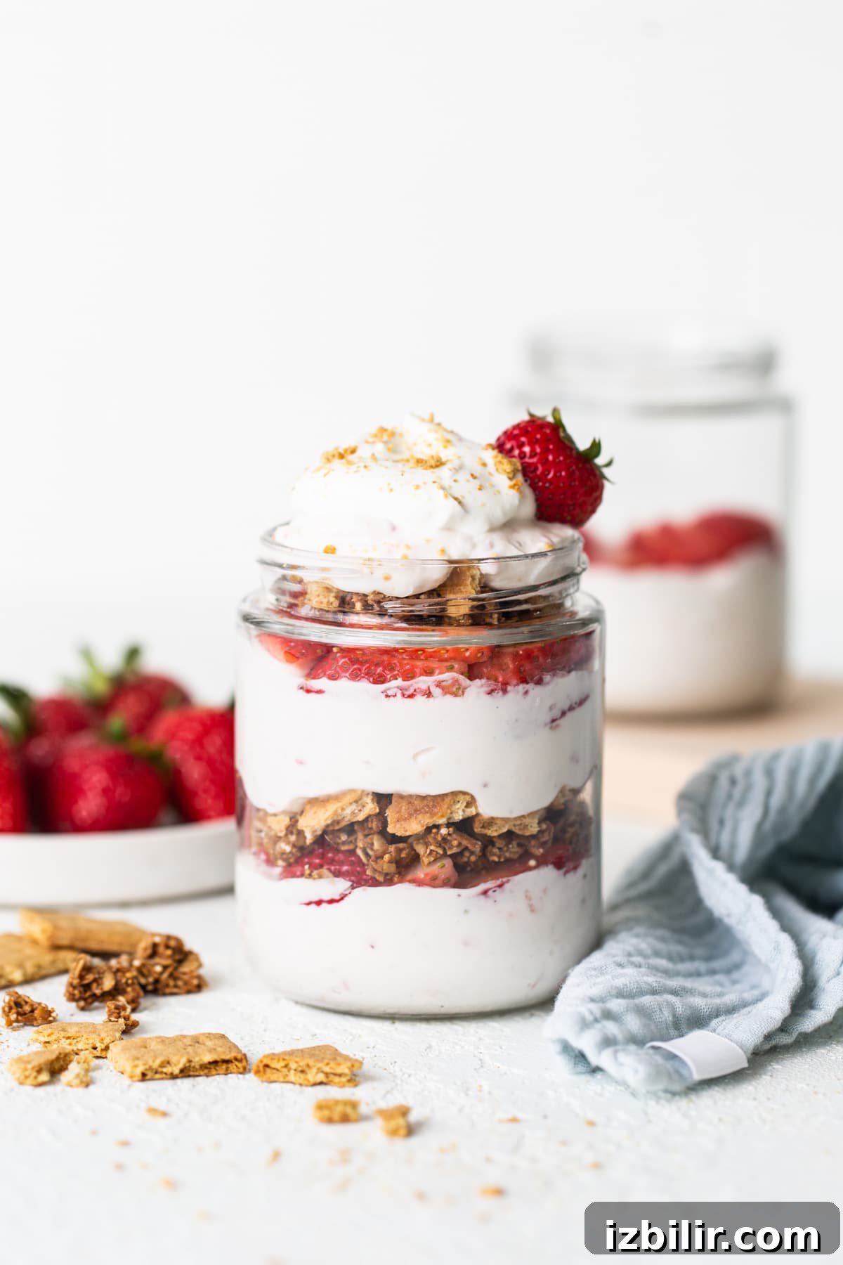 Strawberry Protein Cheesecake Jars with Cottage Cheese 7 Strawberry granola parfait in a jar.