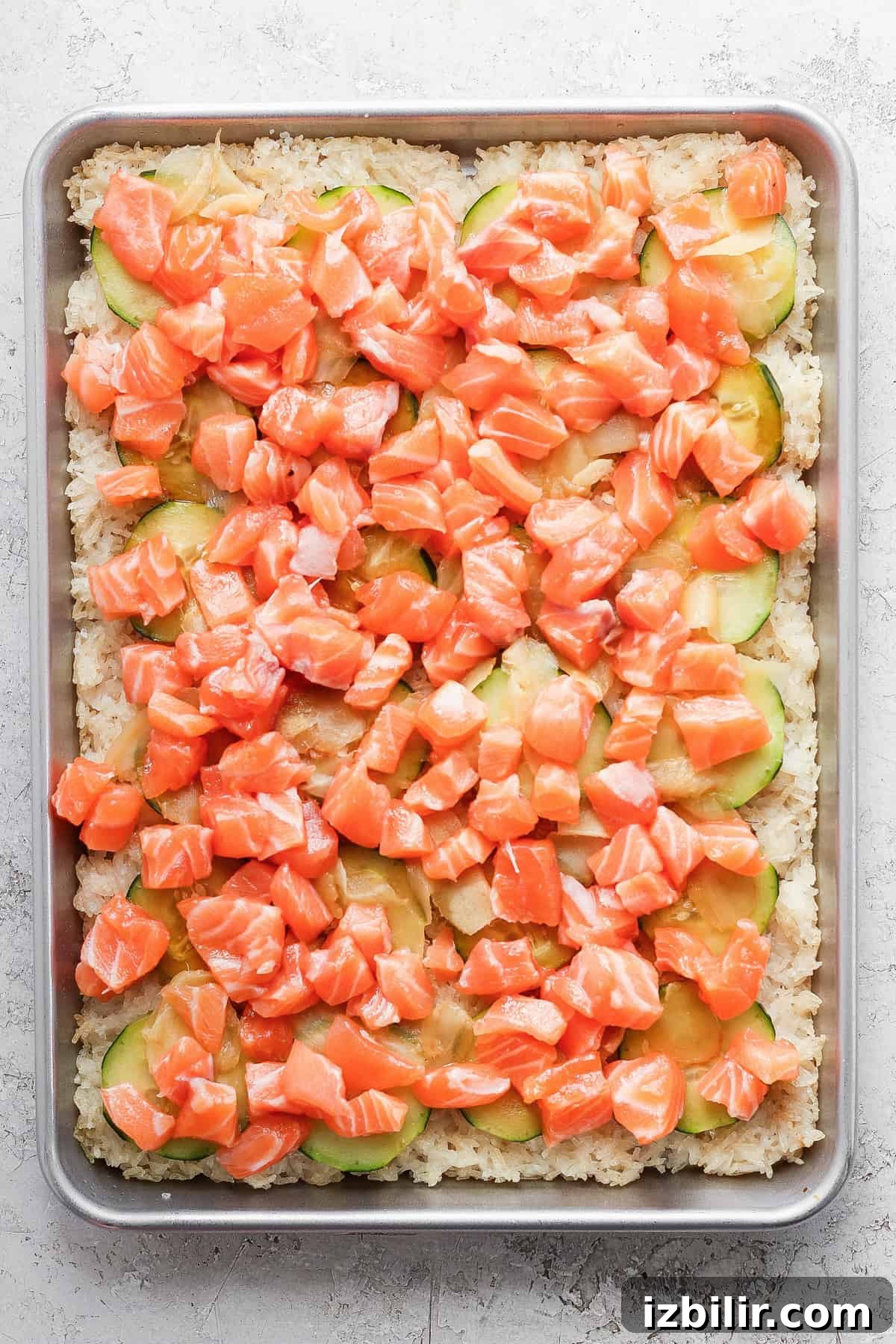 Sheet-Pan Salmon with Crispy Golden Rice 6 Crispy rice sheet topped with salmon and cucumber