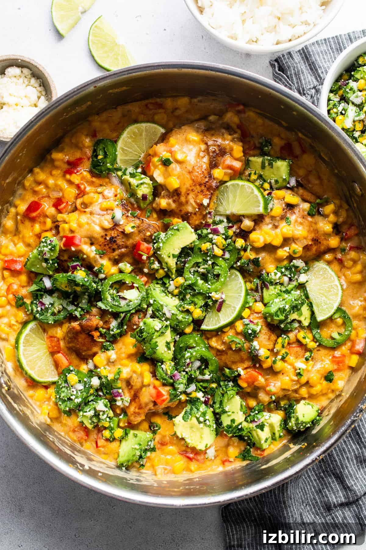 Stovetop Creamy Street Corn Chicken Skillet 2 A bowl of chicken with creamy corn sauce and rice.