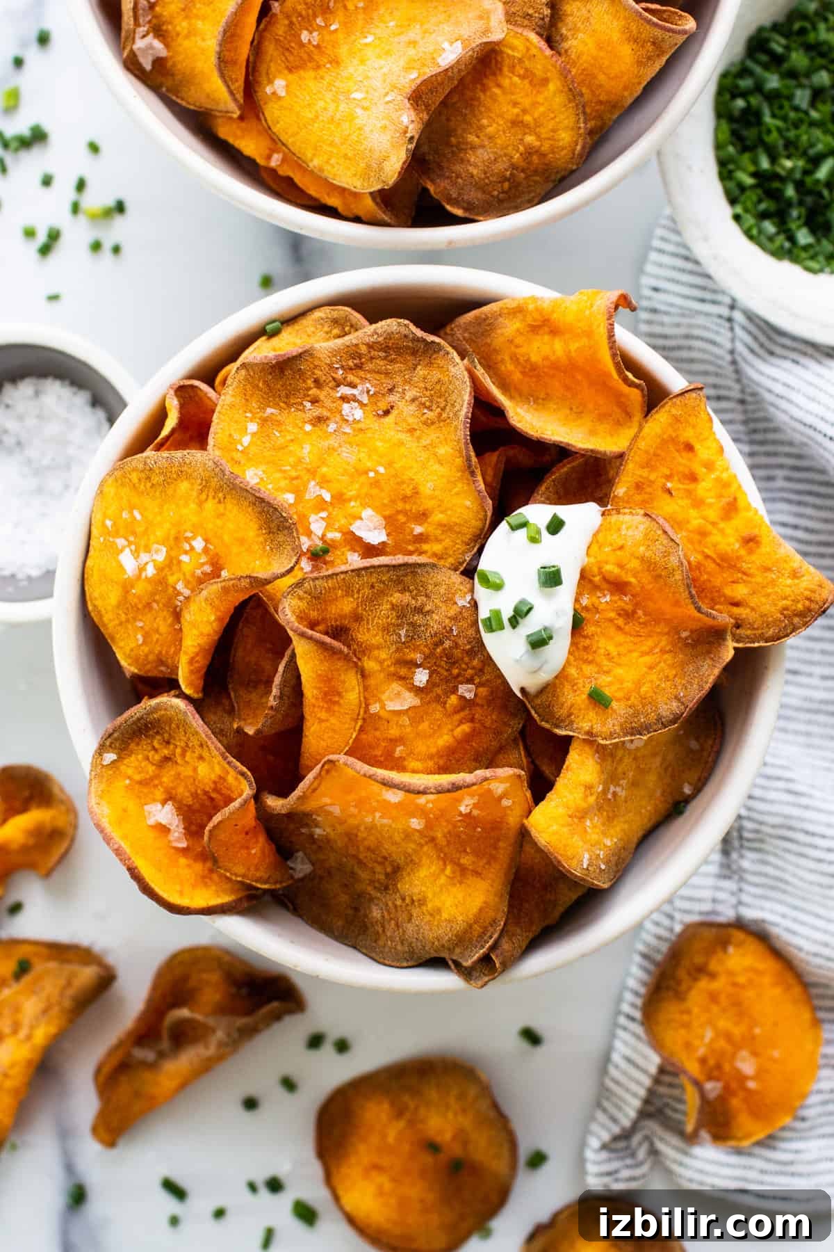 Sweet potato chips with sour cream and chives.