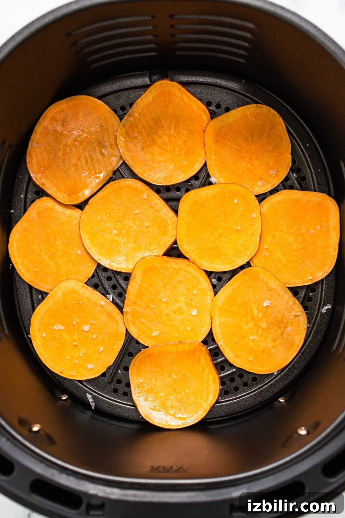 Sweet potato chips in an air fryer.