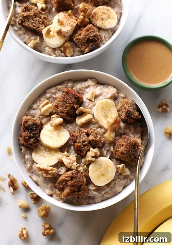 Stovetop Fluffy Banana Oatmeal Recipe 2 Two bowls of oatmeal with bananas and walnuts.