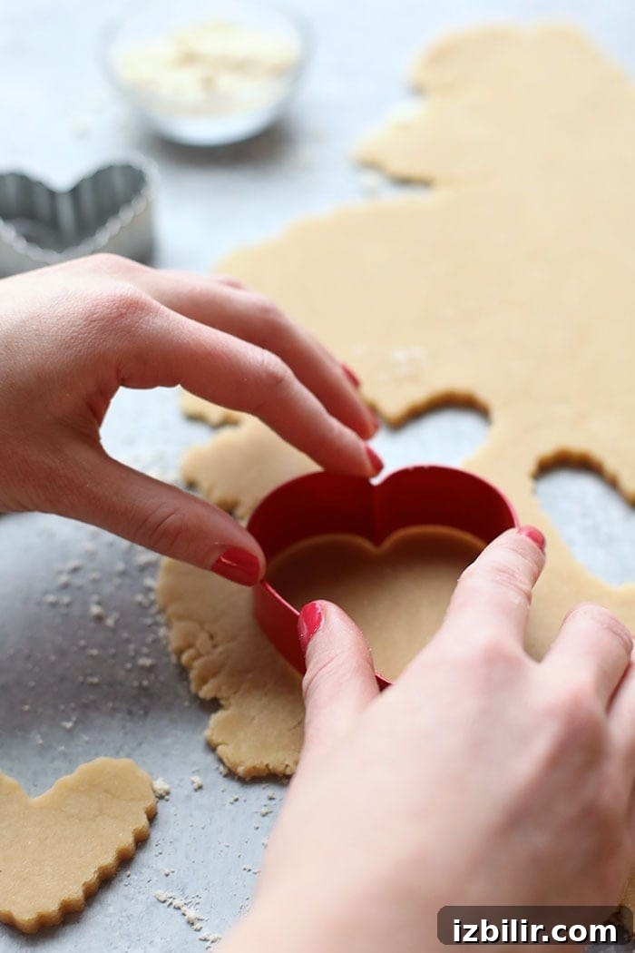Cutting out sugar cookies Cutting out sugar cookies