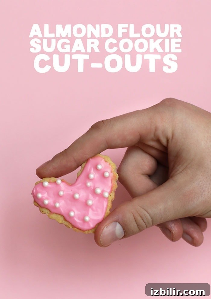 Frosted almond flour sugar cookie A sugar cookie with pink frosting and sprinkles