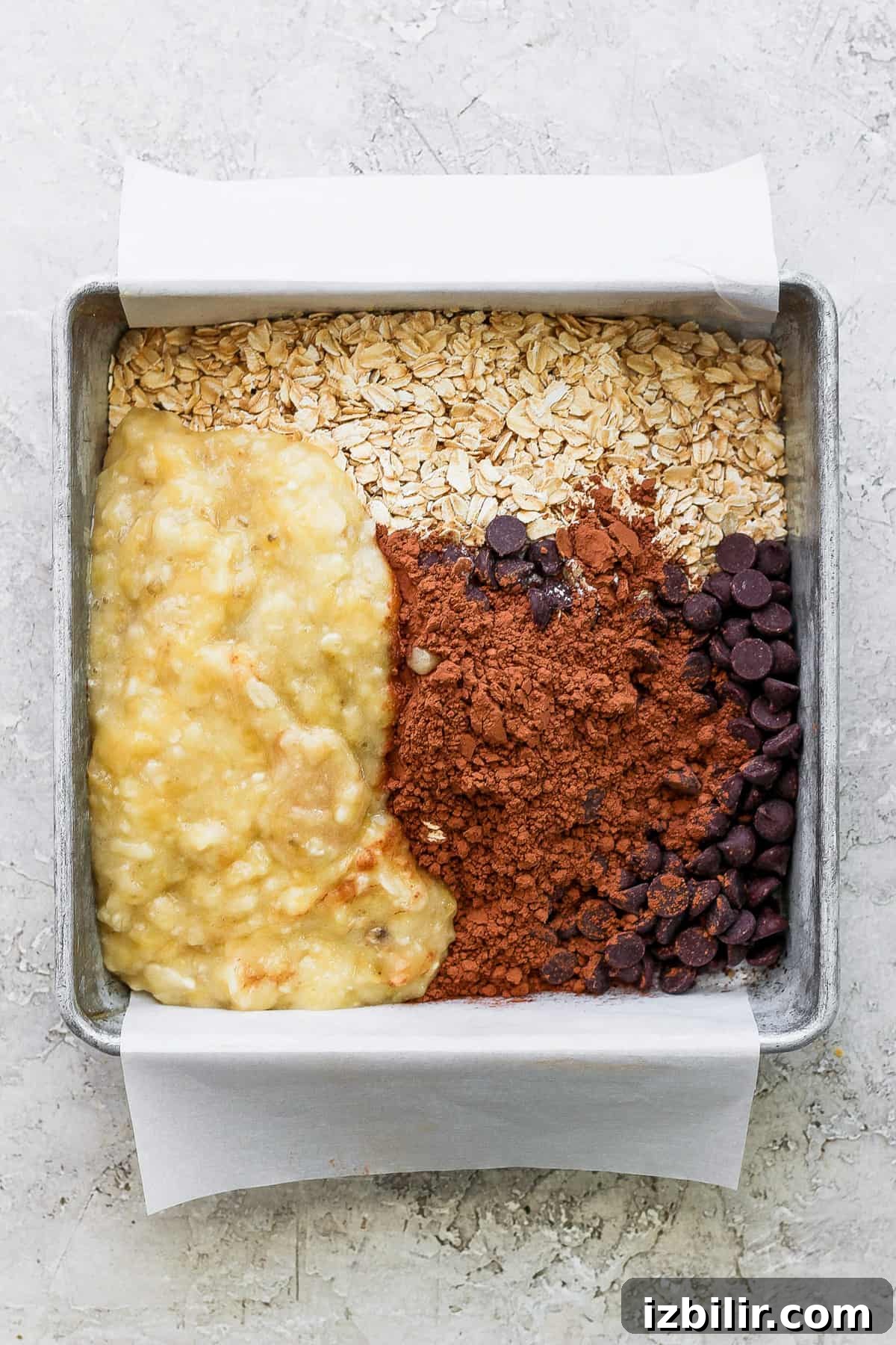 A baking pan filled with ingredients for banana bread.
