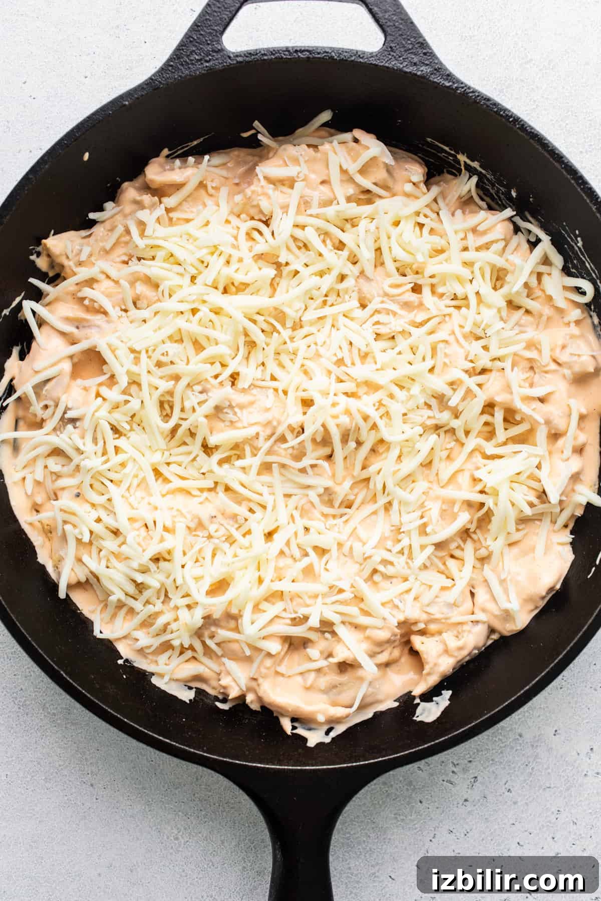 Buffalo Chicken Dip with Whipped Cottage Cheese Recipe 4 Cheesy nachos in a cast iron skillet.