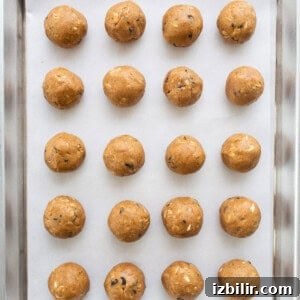 Peanut butter balls on a baking sheet.