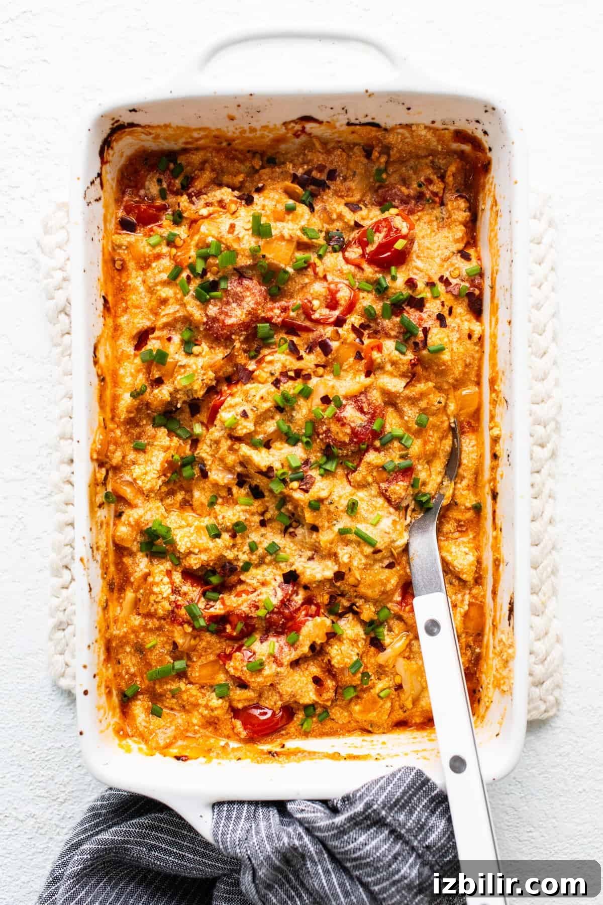 A casserole dish with a fork in it.