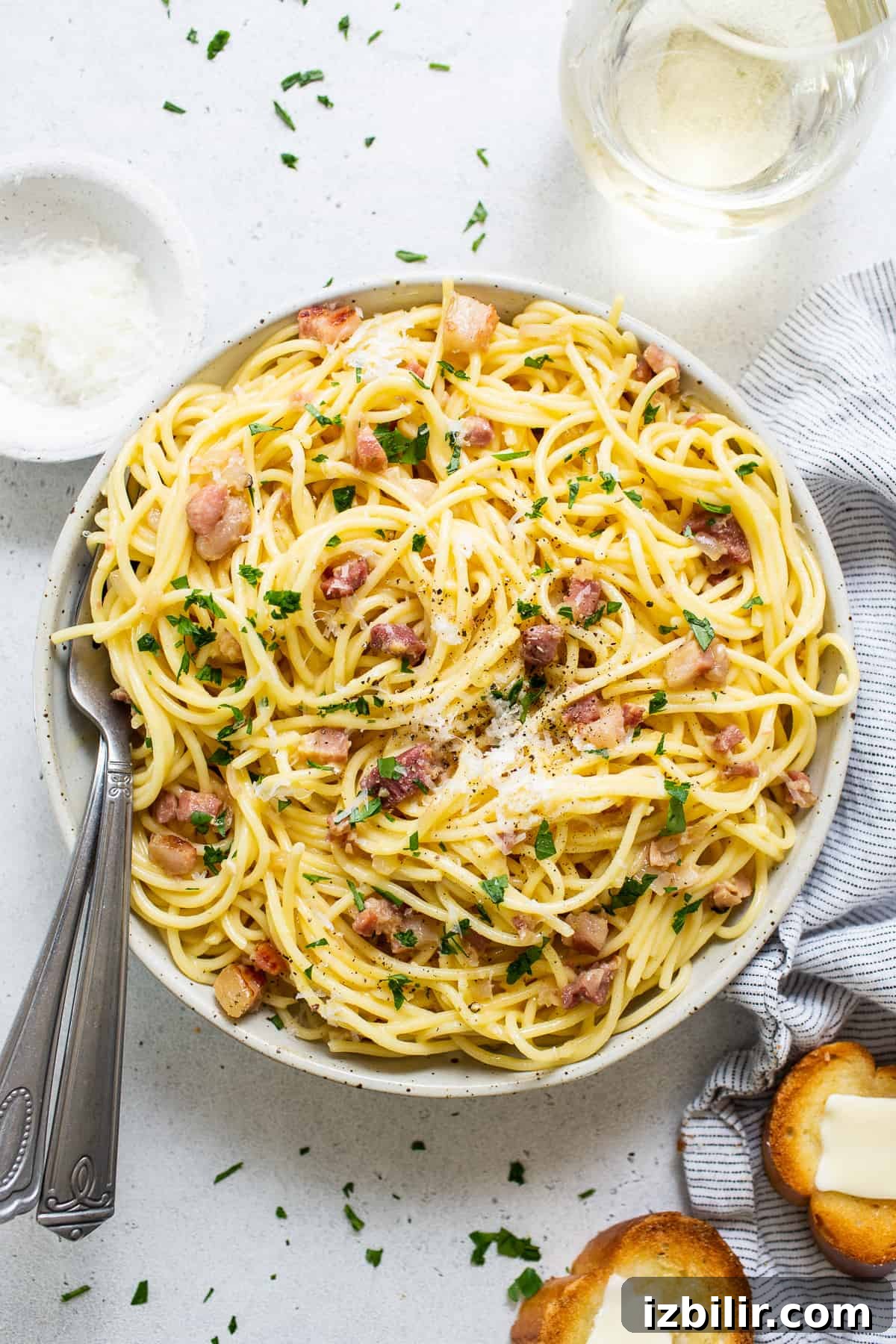 Classic Creamy Carbonara Recipe 2 A bowl of spaghetti with bacon and parmesan.