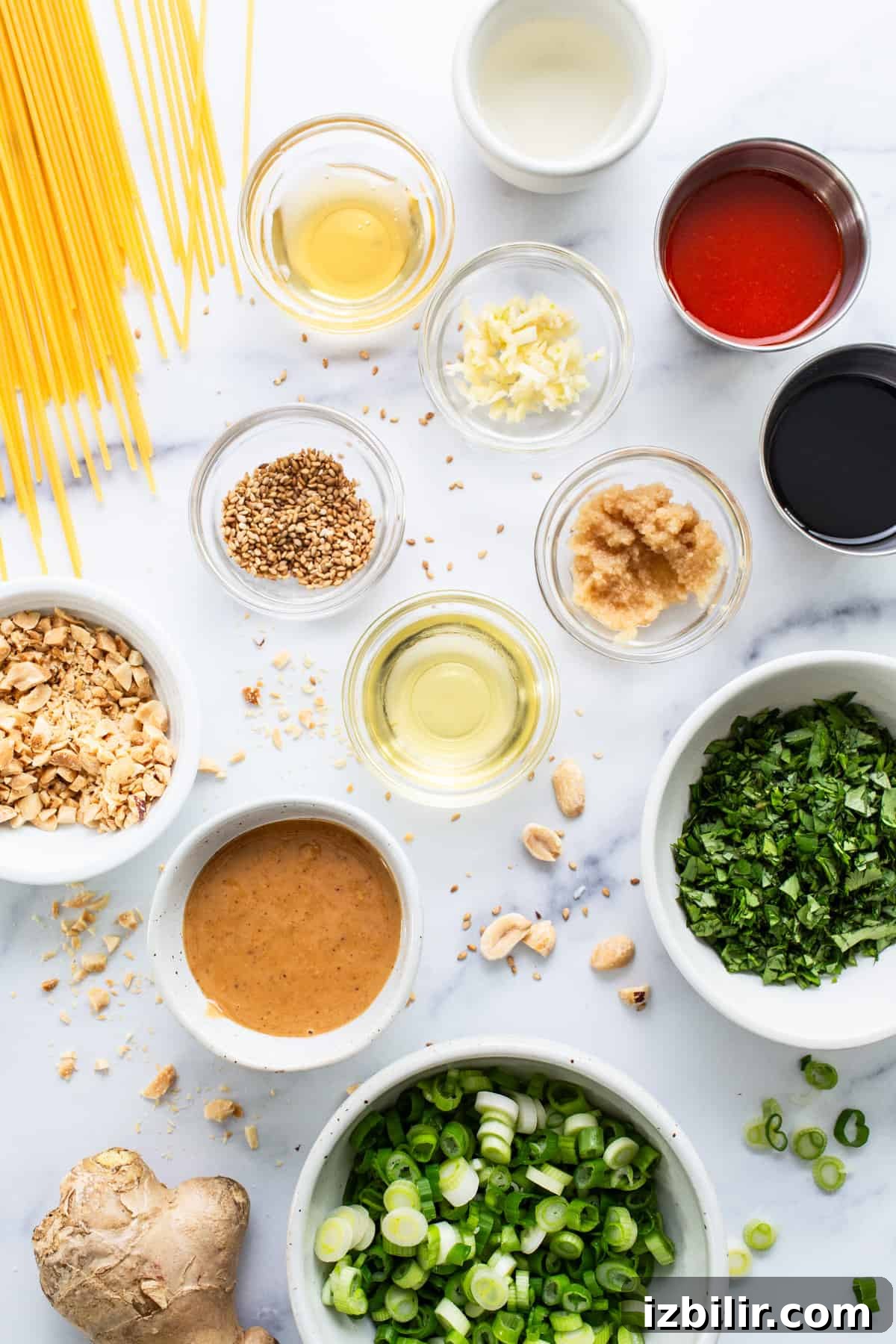 20-Minute Thai Peanut Noodles with Creamy Sauce 3 Ingredients for asian noodles on a white marble table.
