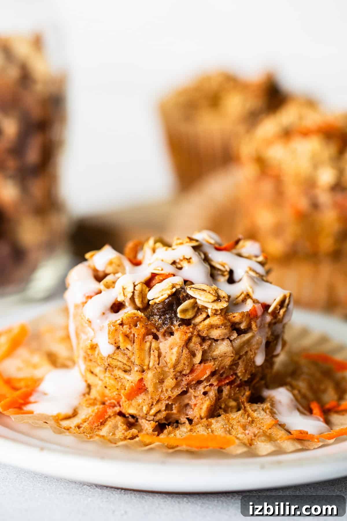 Carrot granola muffins on a white plate.