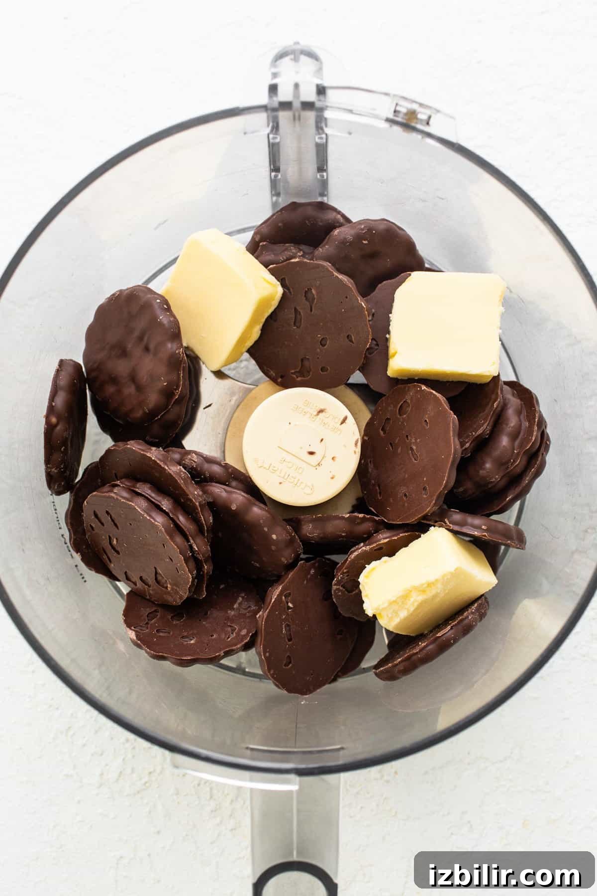 Thin Mint Chocolate Protein Mousse Cups 3 A bowl with chocolate and butter in it.