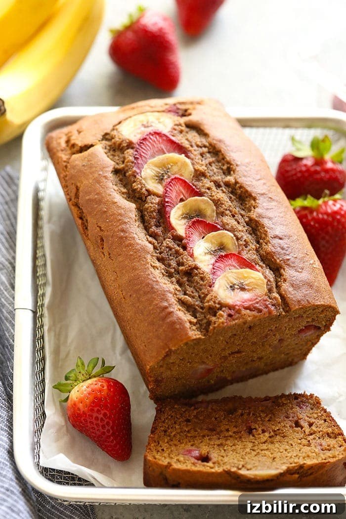 Moist Strawberry Banana Bread Recipe 2 Slice of strawberry banana bread on a plate