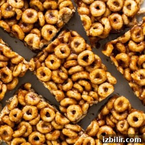 A pile of cereal bars on a white plate.