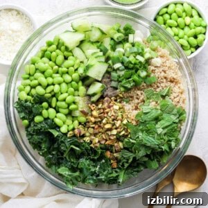 Creamy Green Goddess Quinoa Salad with Avocado and Herb Dressing 5 Bowl of quinoa salad topped with crumbled feta and black pepper